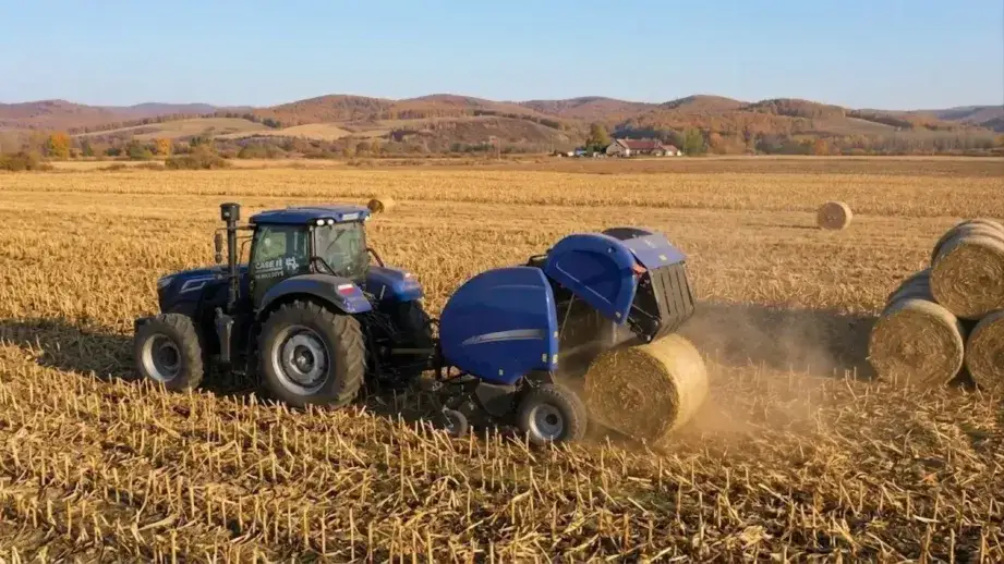 round baler at work in a hay field producing bales for either net wrap or twine wrapping depending on the operation requirements — net wrap requires checking the roll tension and knife cut integrity before each session while twine requires verifying the twine path is clear from all spools through the tension mechanism and both wrapping systems require confirming the wrap quantity setting matches the target for the crop and storage conditions