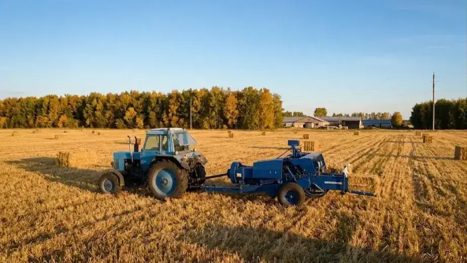 9YF-2200S square baler with hammer-claw pickup operating in a corn stover field showing how the hammer-claw and shredder combination handles dense standing stalk material that standard spring-tooth balers cannot process effectively